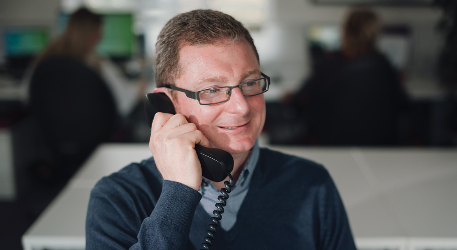 Man on the phone to Medilink Customer Services