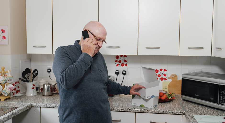 Man on the phone to Medilink Customer Services